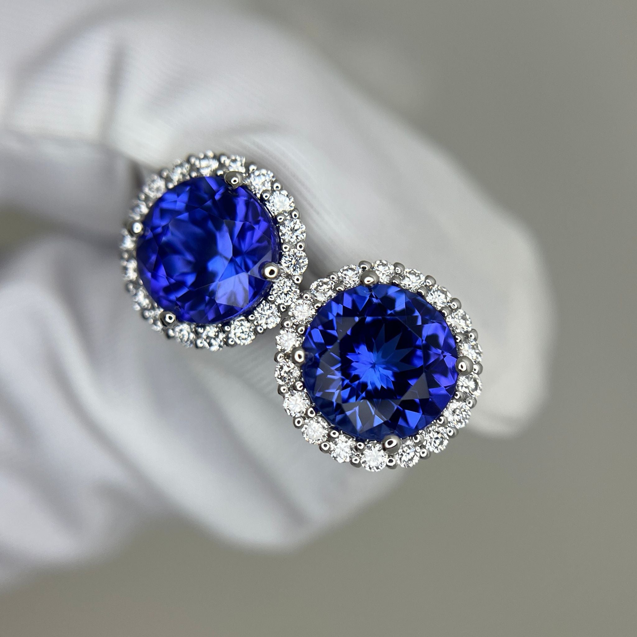 Exceptional Tanzanite (+5 Carat) and Diamond Halo Stud Earrings – 18ct White Gold