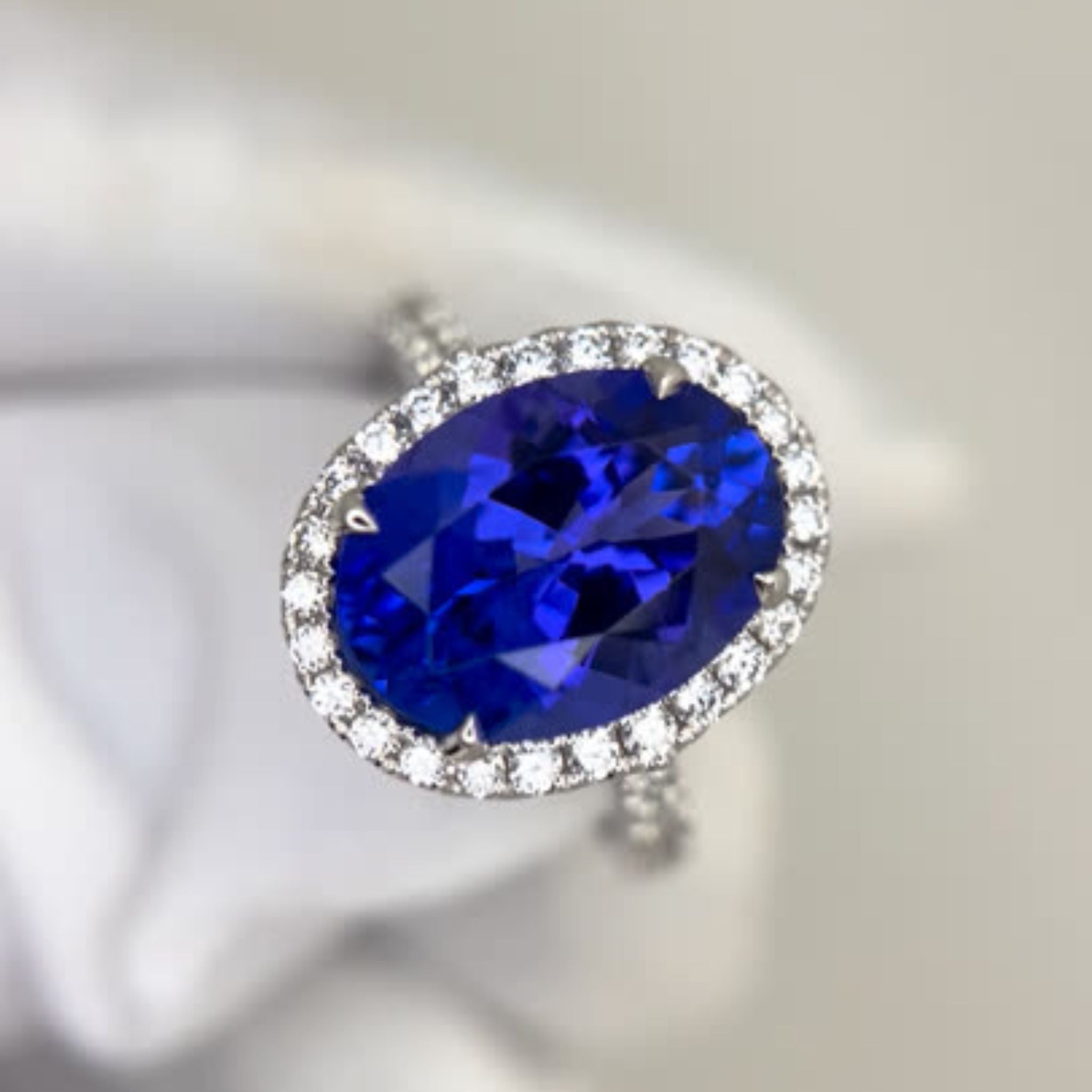 Exceptional Tanzanite 5.00 Carat Oval Diamond Halo Ring