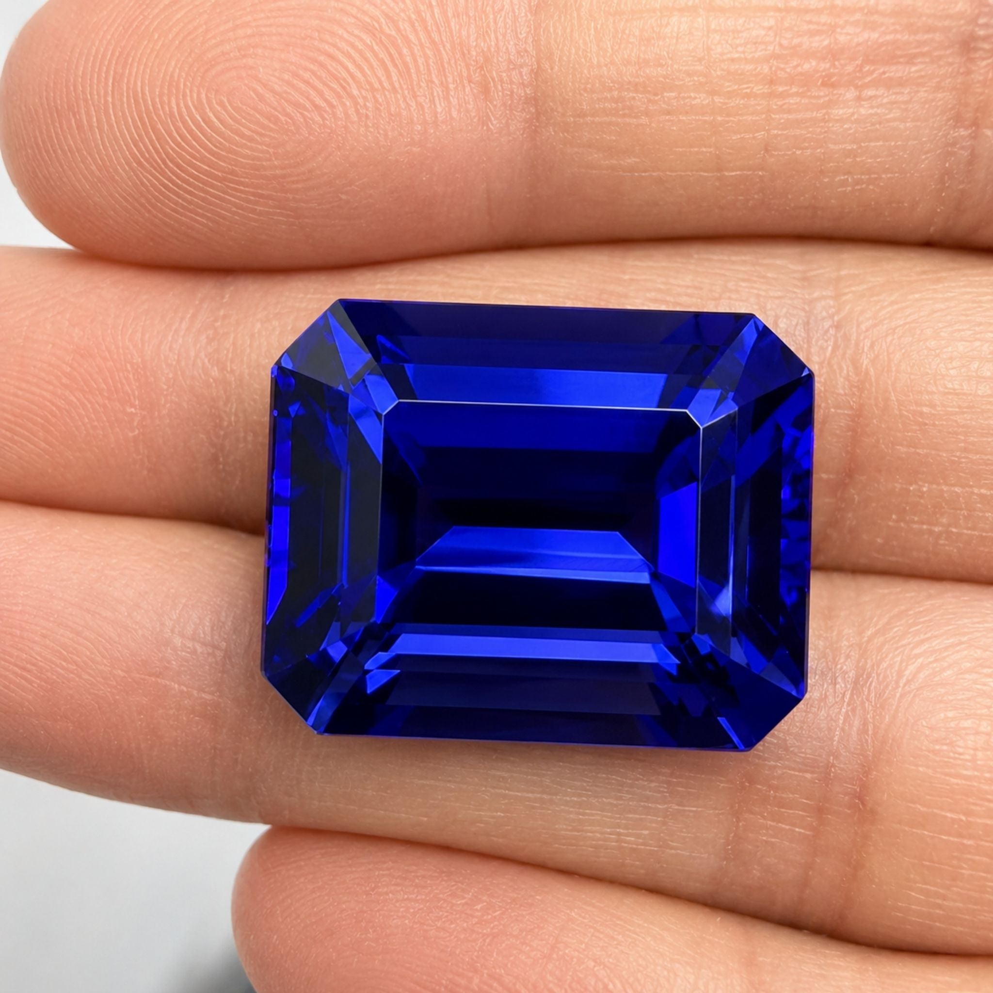 Emerald-cut tanzanite gemstone with vivid royal blue colour
