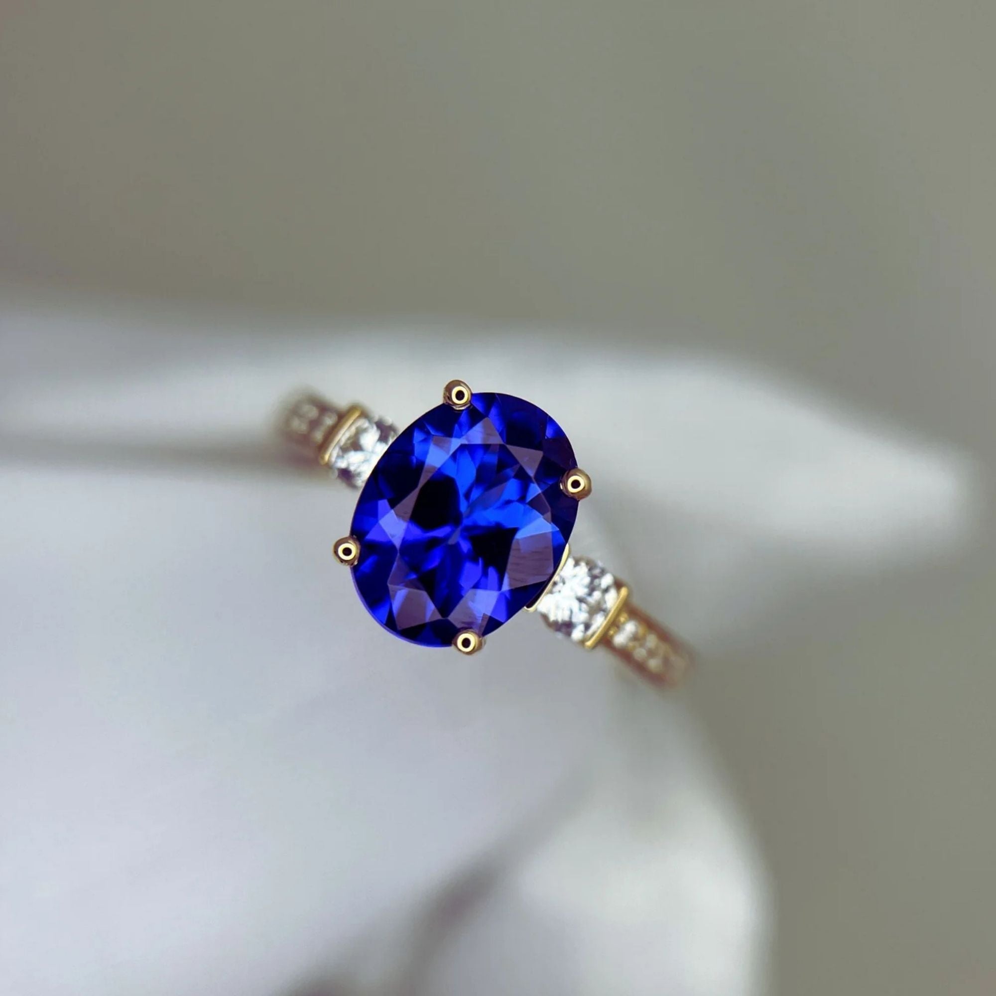“Evening Sky” Oval Tanzanite & Diamond Ring - Yellow Gold
