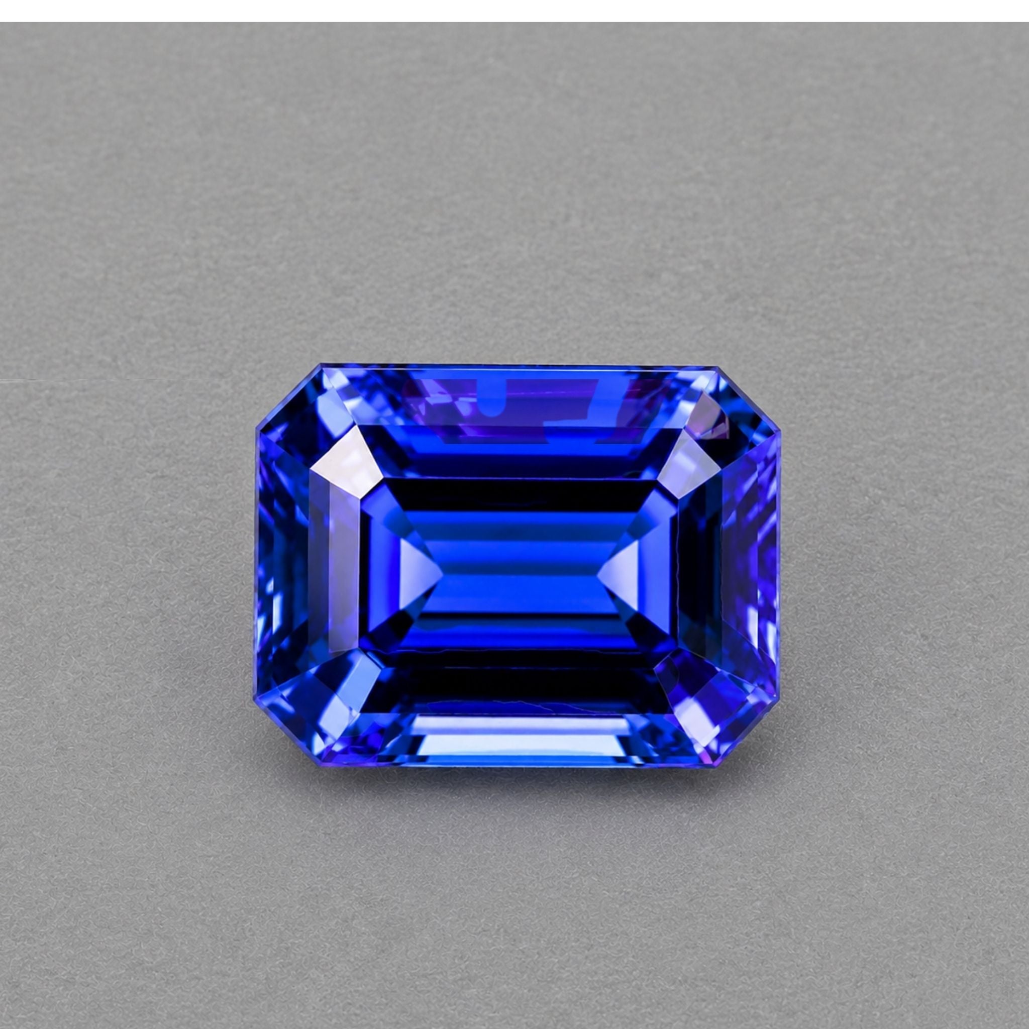 Emerald-cut tanzanite gemstone with vivid royal blue colour