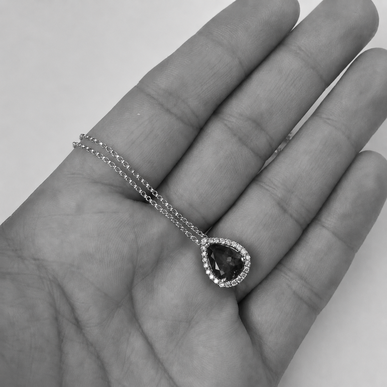 Pear-Shaped Tanzanite Pendant With Diamond Halo