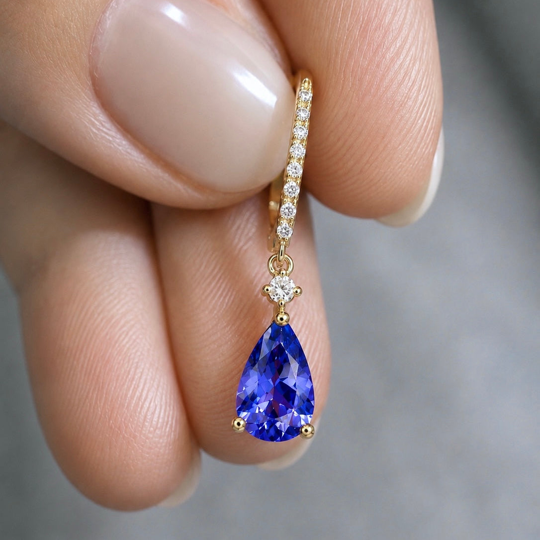 
Pear-shaped blue-violet tanzanite earrings with brilliant diamonds
