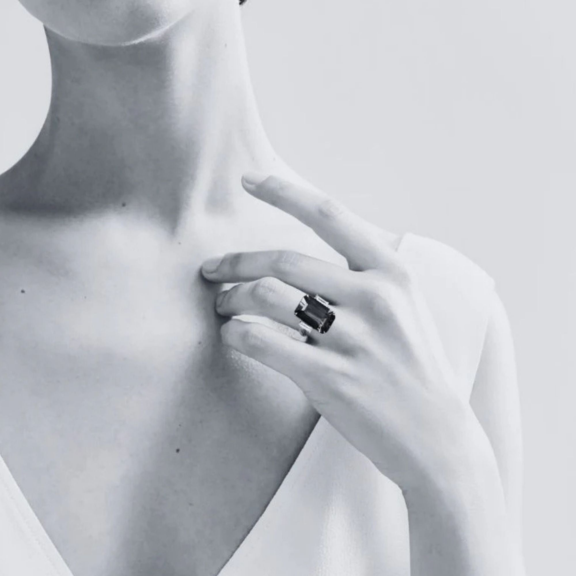 9 Carat Emerald Cut Tanzanite Ring with Baguette Diamonds